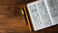 Designer desk with wireframe sketches for responsive website. Royalty Free Stock Photo