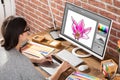 Designer Drawing Flower On Computer Using Graphic Tablet Royalty Free Stock Photo