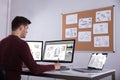 Designer Drawing Suitcase On Computer Using Graphic Tablet