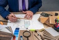 Designer draws a house design with a choice Royalty Free Stock Photo