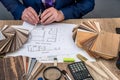 Designer draws a house design with a choice Royalty Free Stock Photo