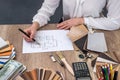 Designer draws a house design with a choice Royalty Free Stock Photo