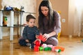 Designer games mom and baby. Baby Boy And Mother Playing Together With Construction Set Toy Royalty Free Stock Photo