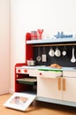 Designer kitchen for children with oven, stove, drawers and kitchen utensils ready for play Royalty Free Stock Photo