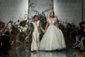 Designer Madeline Gardner and model walk the runway during the Morilee by Madeline Gardner Spring 2020 bridal fashion show