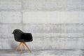 Designer, modern armchair in grey, loft style interior Royalty Free Stock Photo