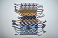 Designer new unique colorful and multi-colored friendship bracelets handmade of embroidery bright floss and thread with knots isol Royalty Free Stock Photo
