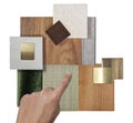 designer's hand selecting interior samples consists wooden vinyl flooring tiles, stone tile quartz, gold stainless, veneer Royalty Free Stock Photo