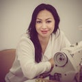 Designer with sewing machine Royalty Free Stock Photo