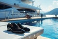 designer shoes by the poolside of a luxury yacht