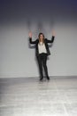Designer Stefania Bandiera acknowledges the applause of the audience after the Les Copains show Royalty Free Stock Photo