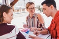 Designer and typography worker choosing pantone for printing