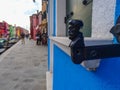 Designer window holder on a blue house on Burano island near Venice Italy Royalty Free Stock Photo