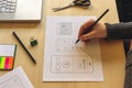 Designer wireframing a mobile App Royalty Free Stock Photo