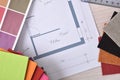 Designer workbench detail with home plan on wooden table top Royalty Free Stock Photo