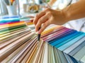 Designer works with pantone scale in art studio. Royalty Free Stock Photo