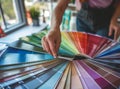 Designer works with pantone scale in art studio. Royalty Free Stock Photo