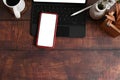 Designer workspace with tablet, smart phone, coffee cup and pencil holder on wooden desk. Royalty Free Stock Photo