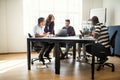 Designers having a meeting together around an office table Royalty Free Stock Photo