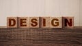Design Word on Wooden Cubes. Branding redesign rebranding marketing concept