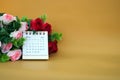 Desk calendar for February 2024 on a gold background Royalty Free Stock Photo