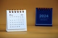 Desk calendar for February 2024 on a gold background Royalty Free Stock Photo