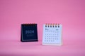 Desk calendar for February 2024 on a pink background Royalty Free Stock Photo