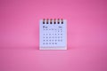 Desk calendar for February 2024 on a pink background Royalty Free Stock Photo