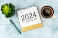 2024 Desk Calendar, Pen and cup of coffee Royalty Free Stock Photo