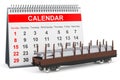 Desk calendar and railroad car with stack of rolled metal products