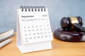 Desk calendar for September 2024 and judge\'s gavel