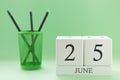 Desk calendar of two cubes for June 25