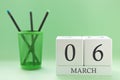 Desk calendar of two cubes for March 6