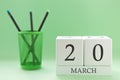 Desk calendar of two cubes for March 20