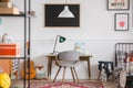 Desk and chair in workspace in vintage genderless kid room Royalty Free Stock Photo