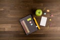 Desk Composition, Beautiful office desk, notebook, Green apple, pencils, ruler on wood