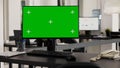 Desk with computer shows greenscreen Royalty Free Stock Photo