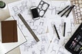 Desk with industrial designers sketches for chair concepts