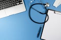 Desk of doctor or physician with stethoscope, laptop computer and clipboard Royalty Free Stock Photo