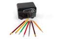 Desk electric pencil sharpener and pencils on a white background Royalty Free Stock Photo