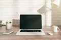 Desk with empty laptop display Royalty Free Stock Photo