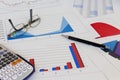 Desk with financial charts and histograms Royalty Free Stock Photo