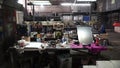 Desk of free space and workshop. Clip. Organized wall of tools and electricity plug. inside a workshop with large