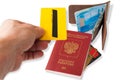 Desk of frequent traveler - angle view. The composition of essential items for trip: passport with multiple entry stamps, foreign Royalty Free Stock Photo