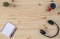 Desk with headphones, agenda and coffee