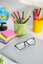 White office desk table with school accessories with office supplies.