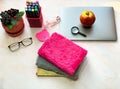Desk with items for student, notebooks and pens. Royalty Free Stock Photo