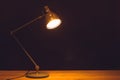 Desk lamp, black background with copy-space