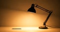 Desk Lamp Illuminating a Pencil on a White Surface Royalty Free Stock Photo