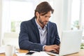 Desk, laptop and businessman with research, thinking and paperwork and financial analyst in office. Consultant, business Royalty Free Stock Photo